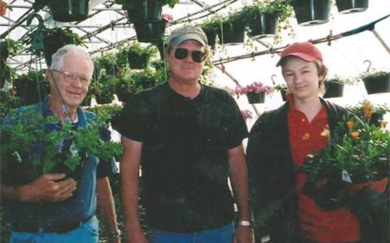 David Osborne with son Andy and grandson Timothy in the greenhouse at the farm