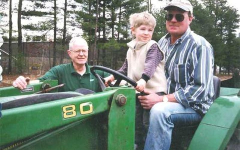 David, Andy and Andy's son Michael working on the tractor